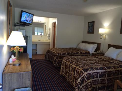 Krevet ili kreveti u jedinici u okviru objekta Port Lodge Motel
