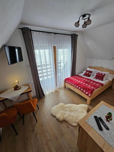 Säng eller sängar i ett rum på Michałowa Turnia