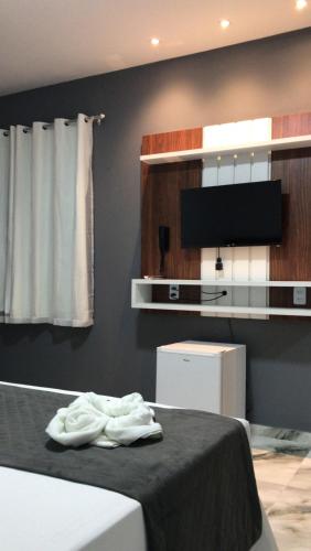 Televisyen dan/atau pusat hiburan di WL IMPERIO HOTEL POUSADA