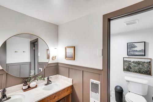 a bathroom with two sinks and a mirror at Mountain-View Condo in Brian Head with Private Sauna in Brian Head