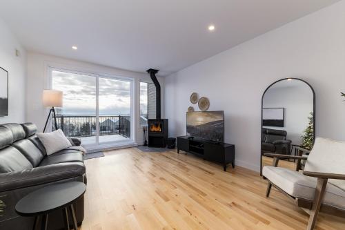 Posezení v ubytování Chalets Grande-Pointe au Massif de Charlevoix -Vélos - Rando -ski-in ski-out