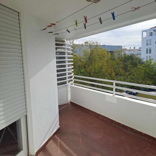 an empty balcony with a view of a city at Casa das Borboletas in Évora