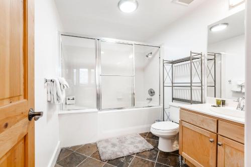 a bathroom with a shower and a toilet and a sink at Crestview Condominiums by All Seasons Resort Lodging in Park City