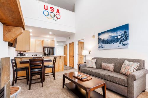 a living room with a couch and a table at Crestview Condominiums by All Seasons Resort Lodging in Park City