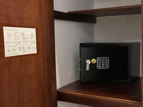 a microwave on a shelf in a room at Hotel La Magdalena in Cartagena de Indias