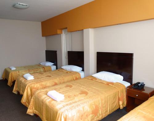 Ένα ή περισσότερα κρεβάτια σε δωμάτιο στο Hotel Gran Sipan