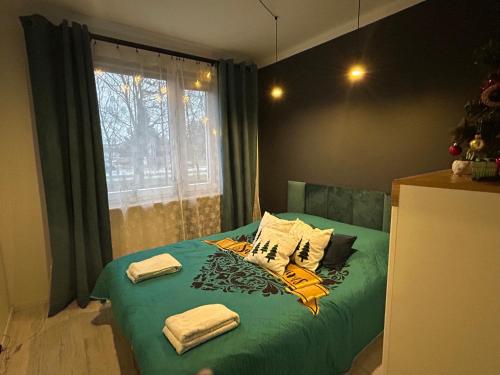 Tempat tidur dalam kamar di Apartament Terebelska P