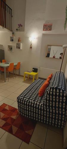 a bedroom with a bed and a table and chairs at Gemme Fiorentine Apartments in front of the train station 5 minutes from the centre Free parking in Florence