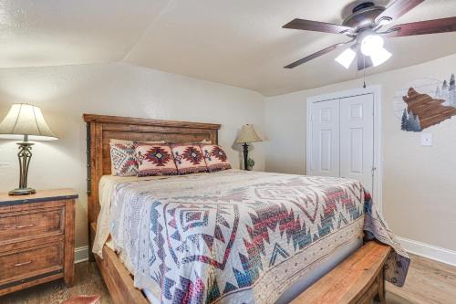 a bedroom with a bed and a ceiling fan at about 3 Mi to Lake Texoma Kingston Family Retreat in Kingston