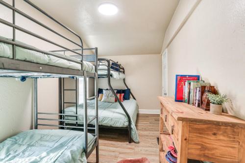 a bedroom with two bunk beds and a desk at about 3 Mi to Lake Texoma Kingston Family Retreat in Kingston