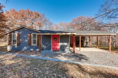 a small blue house with a red door at about 3 Mi to Lake Texoma Kingston Family Retreat in Kingston