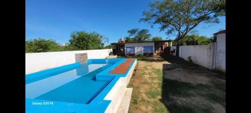 a swimming pool in the backyard of a house at Complejo francesca in Paso de la Patria