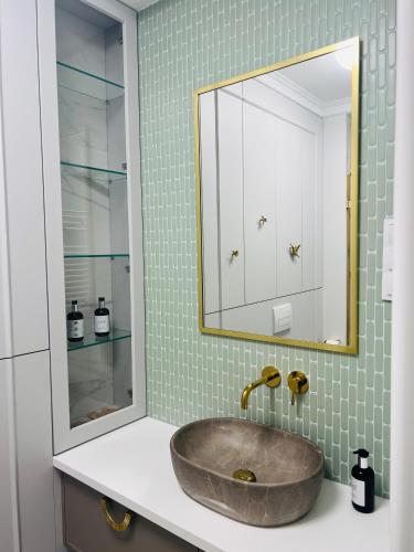 a bathroom with a sink and a mirror at Sosnowy "3" ,Baseny Tropikalne, Ładowarka do elektryków, Faktura, Parking in Kielce