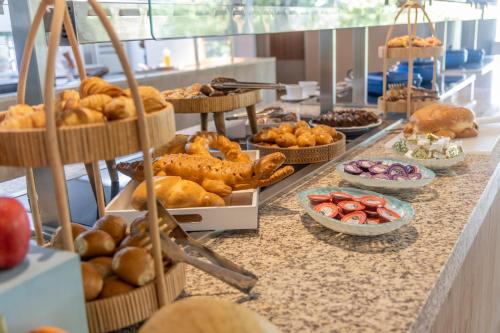 a buffet of bread and pastries on a counter at Grand Sirenis San Andres in San Andrés