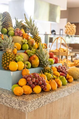 a display of fruits and vegetables on a counter at Grand Sirenis San Andres in San Andrés