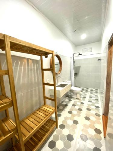 a bathroom with a bunk bed and a toilet at Brahmastra Bali villa in Kubupenlokan