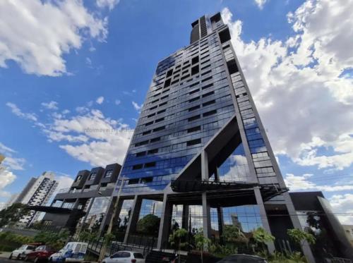 a tall building with windows on the side of it at Estudio Alto e Aconchegante no 32º andar do Vertigo in Campo Grande
