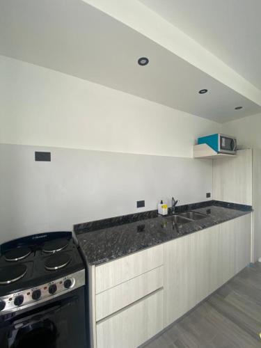 a kitchen with a stove and a counter top at Amar Azul in Mar Azul