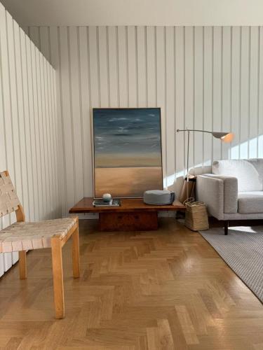 a living room with a couch and a table at Porto Lidador Boutique Ap with Garden - Alvaro in Porto