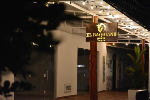 a sign for a barrakula pub in a building at Hotel El Baquiano in San Juan de Arama