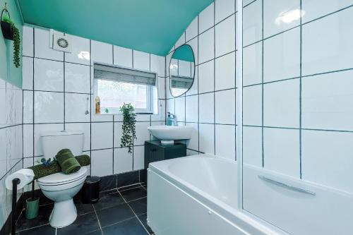 a bathroom with a tub and a toilet and a sink at NEW! Spacious 2-bed home in Chester City-Centre by 53 Degrees Property, ideal for Couples & Small groups, Great Location - Sleeps 5 in Chester