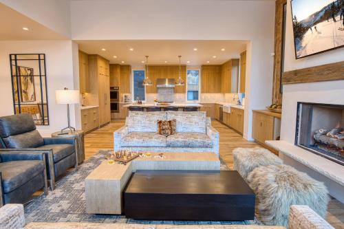 a living room with a couch and a fireplace at Luxe Sun Valley Retreat at River Run in Ketchum