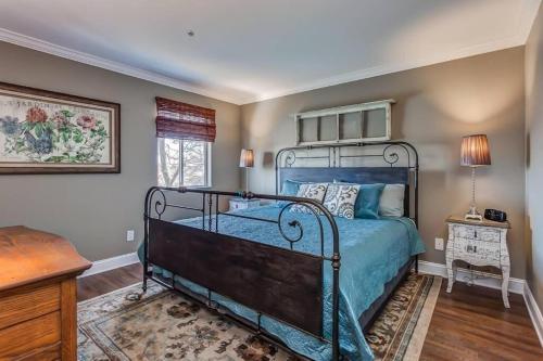 a bedroom with a bed with a blue bedspread at Nashville Downtown Condo -788 in Nashville