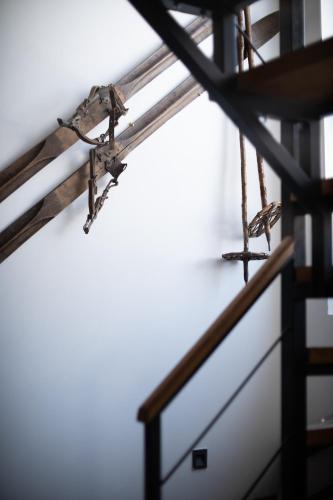 two birds sitting on a rail in a room at Kežman Mountain Houses in Kopaonik