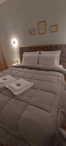 a bedroom with a large white bed with white pillows at FirstLineSkg3 Moodsolutions Living in Thessaloniki