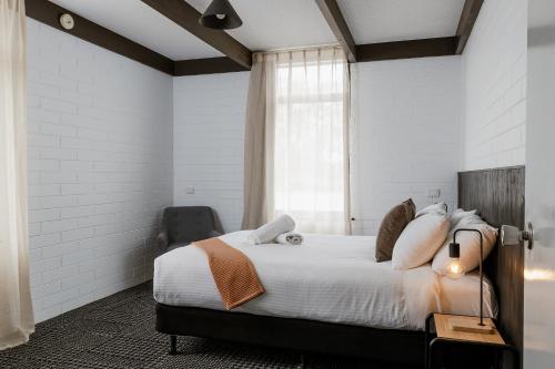 a bedroom with a bed and a window at m hotel in Sale
