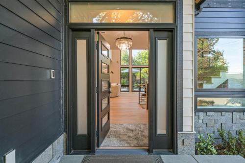 a hallway of a home with a glass door at Bellevue Splendor Birch Room BY Betterstay in Bellevue