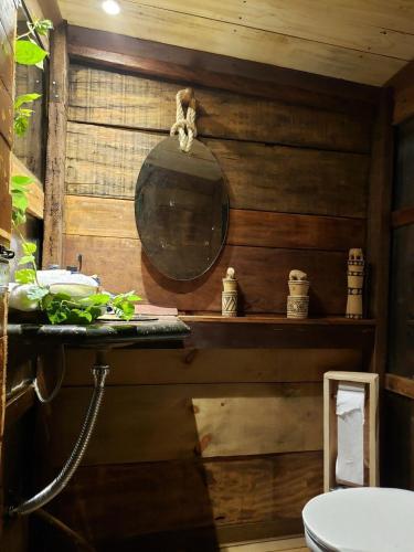 a bathroom with a sink and a mirror on a wall at Casas Lago Paranoá in Paranoá