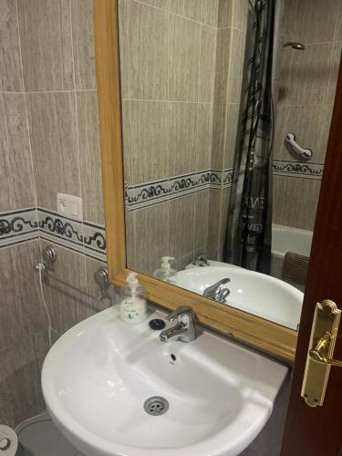 a bathroom with a sink and a mirror at CASA FRANCISCO in El Cuervo