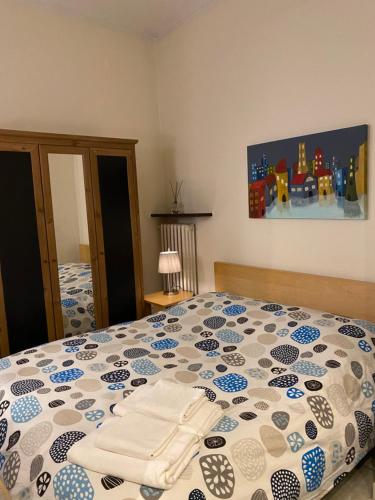 מיטה או מיטות בחדר ב-La palazzina