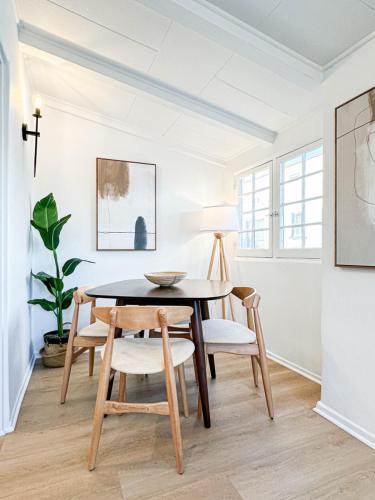 a dining room with a table and chairs at Modern 2-Bedroom Gem Close to Beverly Hills - DOH2 in Los Angeles