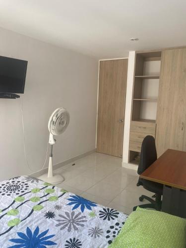 Säng eller sängar i ett rum på Habitacion Apartamento Neiva Conjunto Residencial