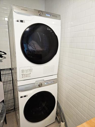 a microwave oven sitting on top of a dishwasher at 8 Hotel in Seoul