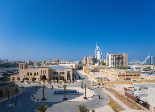 a view of a city with buildings and a street at 7 Star BurjAlArab Hotel View luxury 2 bdr apt with ammenities in Dubai