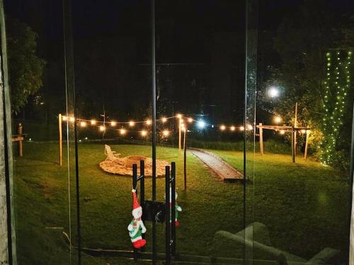 a batting cage with a santa clause on it at night at Recanto Tereza Dias in Lagoinha