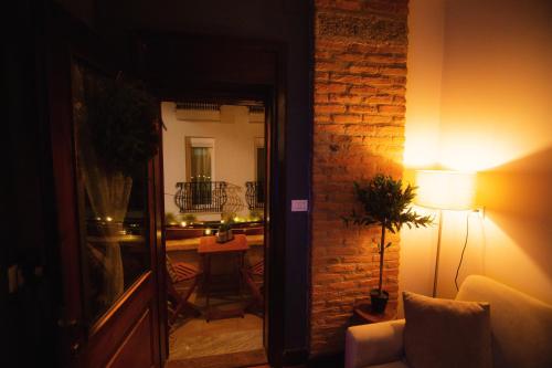 a living room with a couch and a lamp at Villa Elezi 2 in Korçë