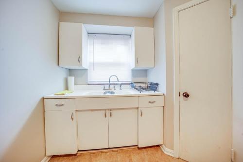 a kitchen with a sink and a window at Cozy Euclid Apartment Near Downtown! in Euclid