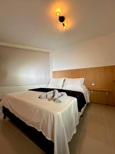 Ein Bett oder Betten in einem Zimmer der Unterkunft TheLuxe ApartaEstudio Laureles 2