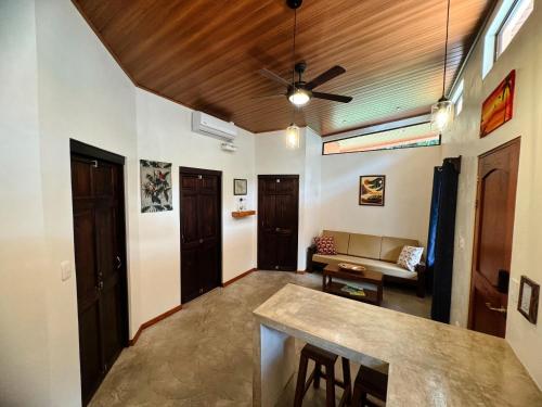a living room with a table and a couch at Brahman Bungalows on Pavones Point in Pavones