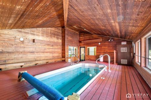 a large pool in a house with a wooden ceiling at Giant Steps #43 W Hot Tub, Sauna, And Game Room! in Brian Head