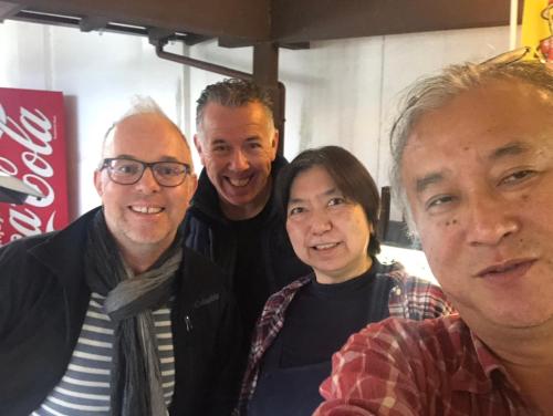 a group of people posing for a picture at Family Ryokan Kawakyu with Showa Retro, private hot spring in Ibusuki