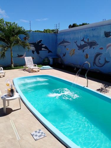 Der Swimmingpool an oder in der Nähe von Casa de praia jatobá Beach