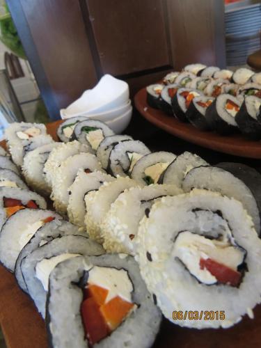 a bunch of sushi on plates on a table at Park Hotel Calama in Calama