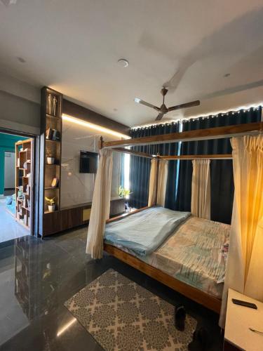 a bedroom with a bed with a canopy at The Retreat in Jhunjhunūn