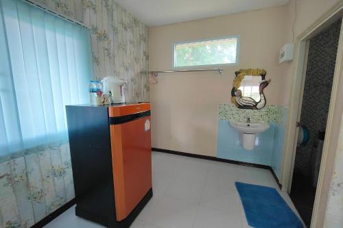a bathroom with a sink and a toilet at The Creek Resort in Ban Rai
