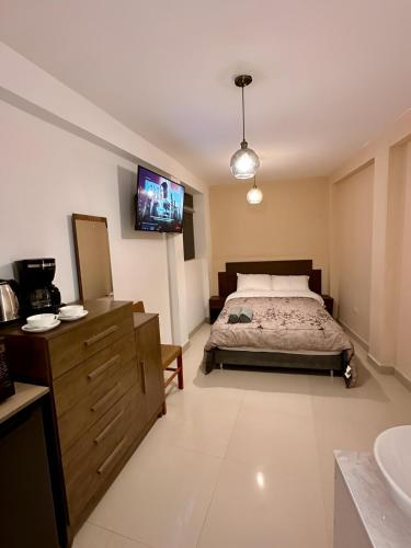 Llit o llits en una habitació de Castellares La Puebla Habitación y estudio en el centro